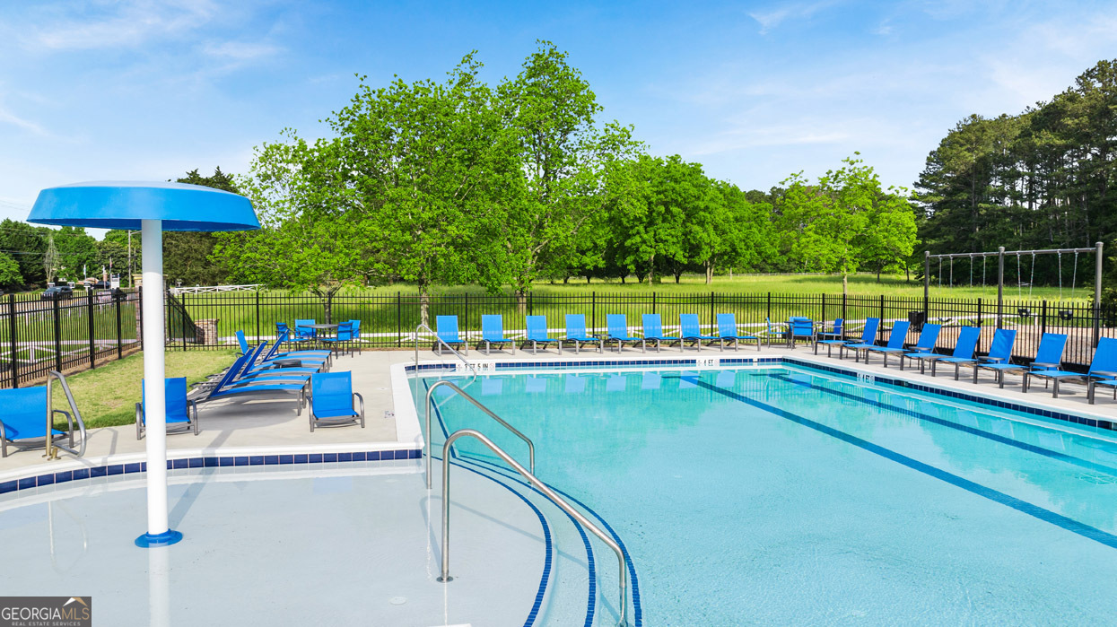 1704 Goodwin Drive Hampton, GA 30228 - Photo 23 of 76 swimming pool view with a seating space and a ocean view