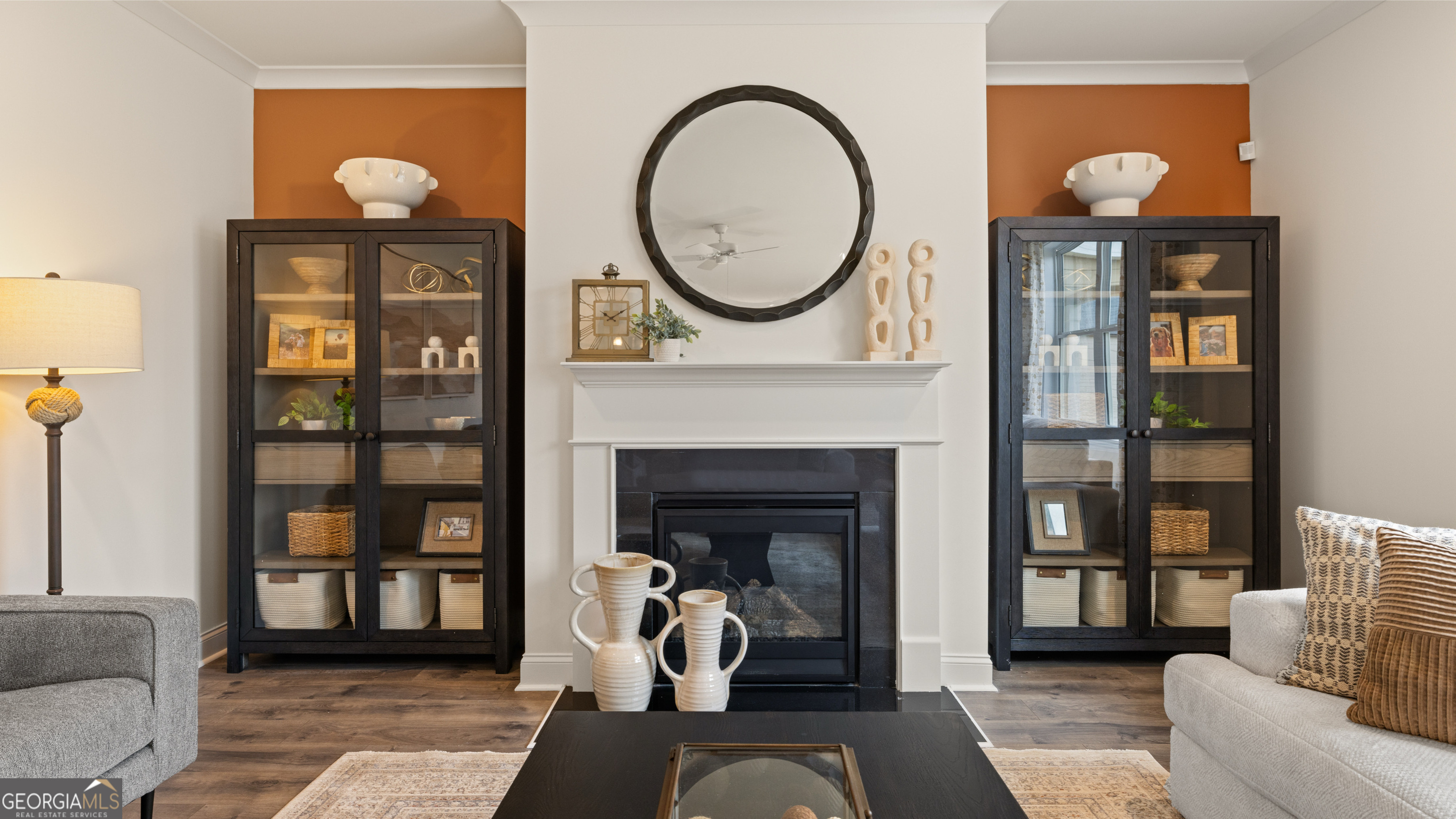 1704 Goodwin Drive Hampton, GA 30228 - Photo 45 of 76 a living room with furniture a fireplace and a potted plant