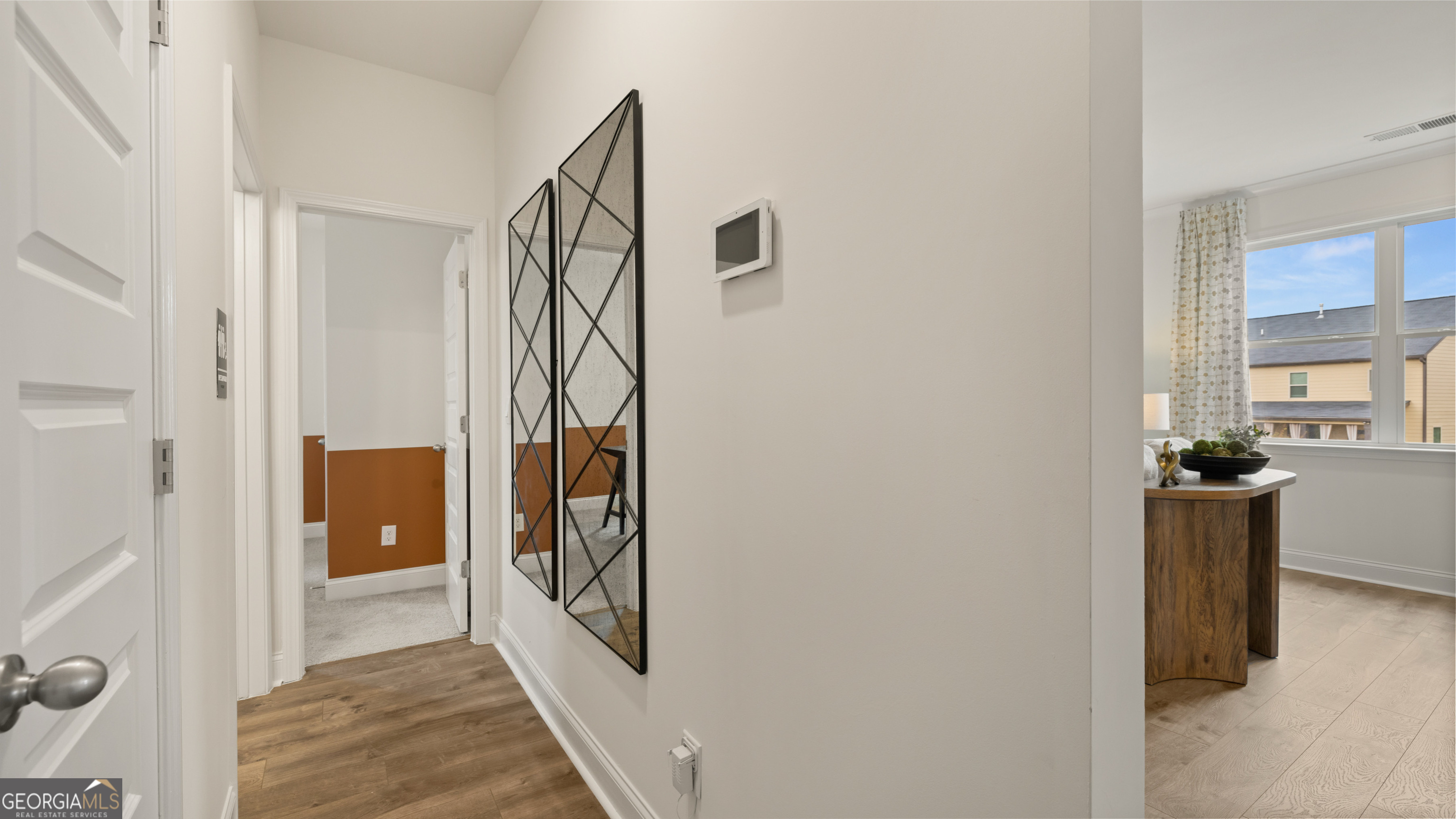 1704 Goodwin Drive Hampton, GA 30228 - Photo 46 of 76 a view of a hallway with a white walls and stairs