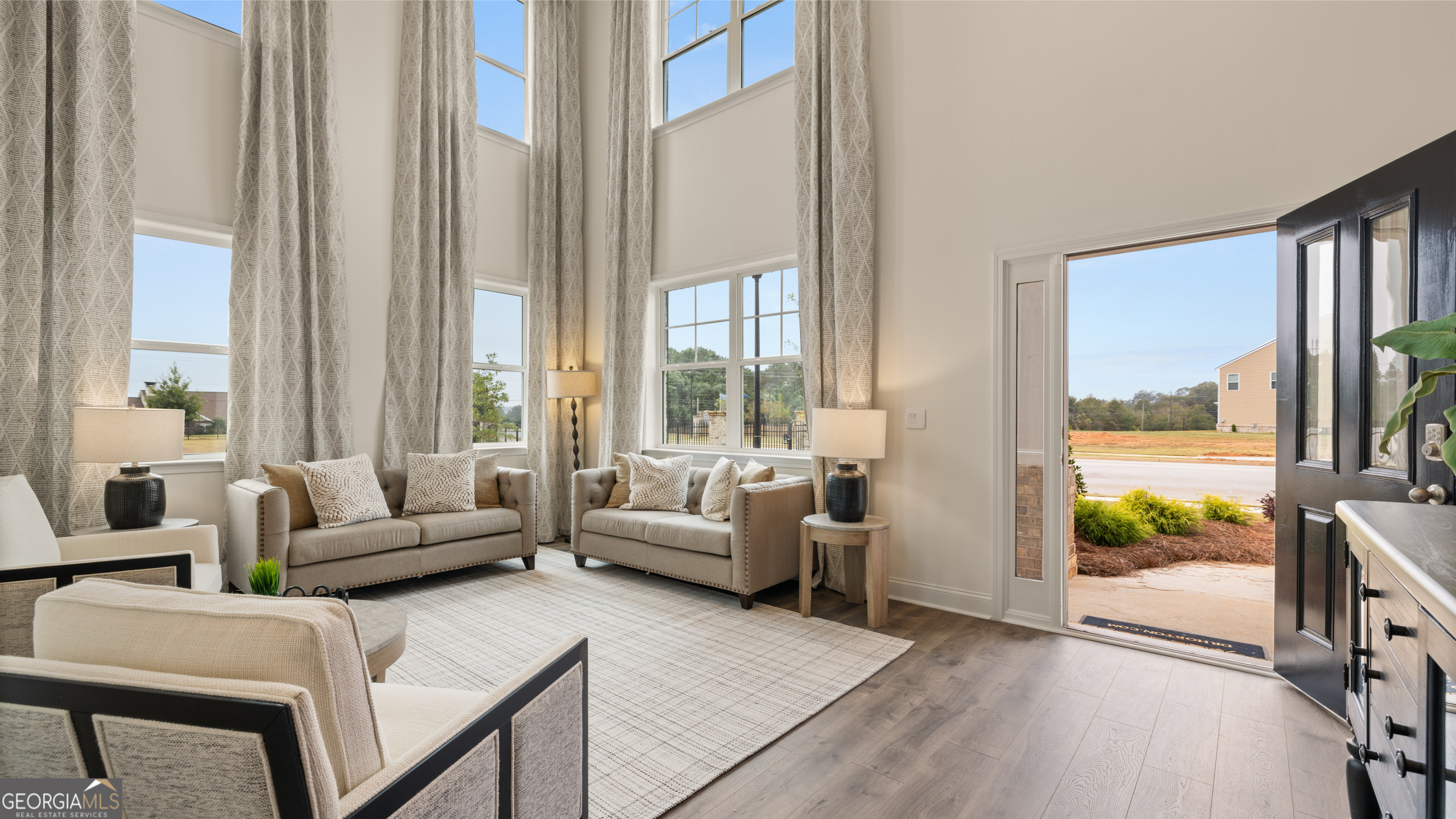 1704 Goodwin Drive Hampton, GA 30228 - Photo 8 of 76 a living room with furniture and a large window