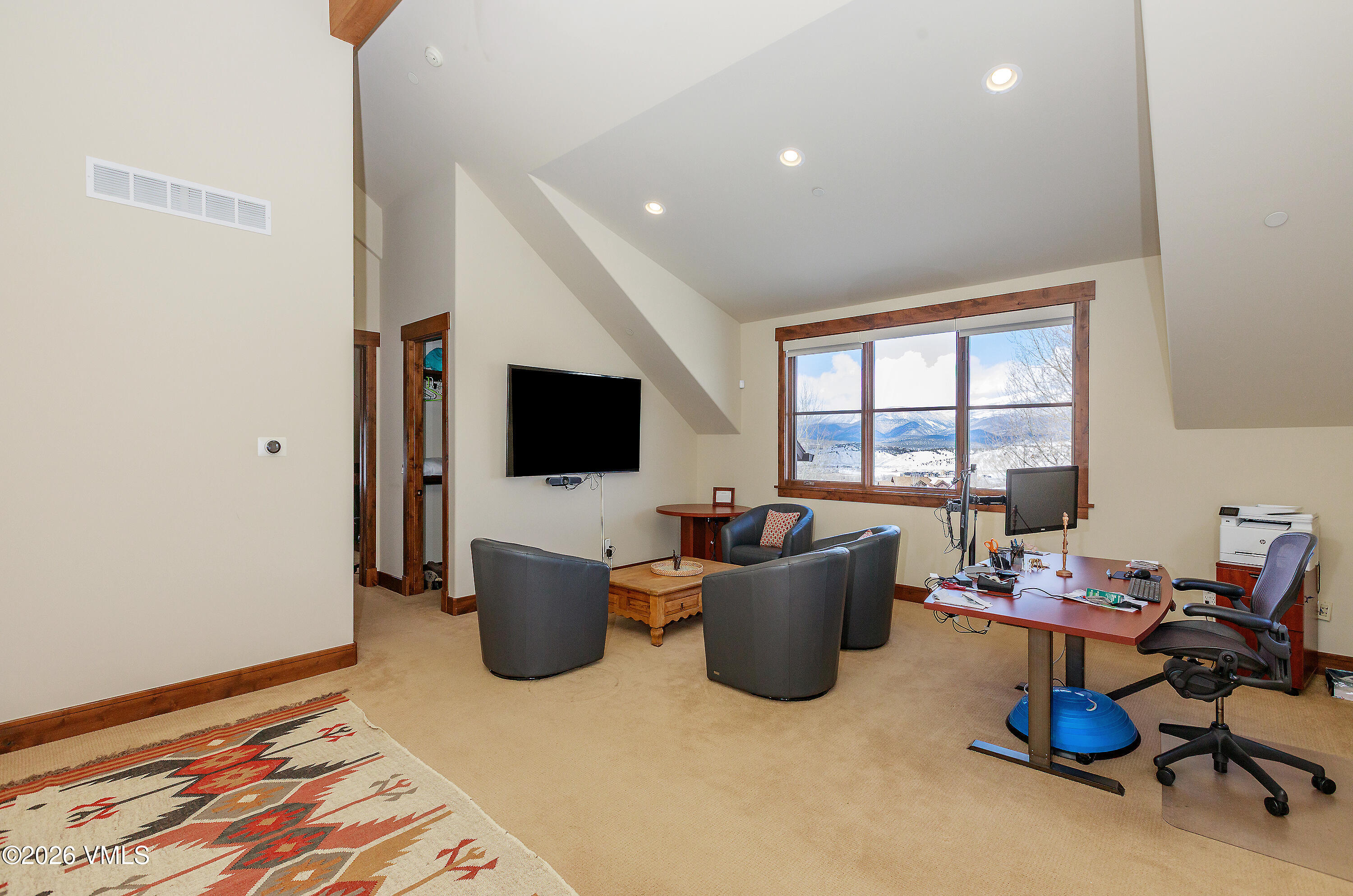 2753 East Haystacker Drive Eagle, CO 81631 - Photo 27 of 41 a living room with furniture and a flat screen tv