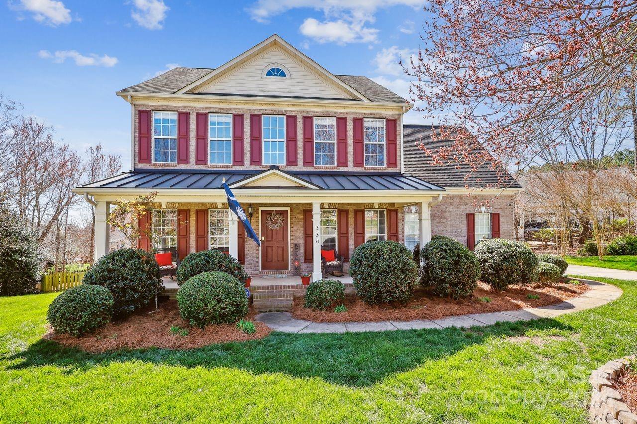 330 Drake Park Avenue Fort Mill, SC 29708 - Photo 1 of 36 a front view of a house with a yard