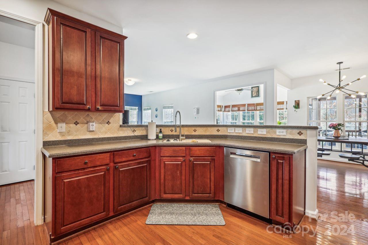 330 Drake Park Avenue Fort Mill, SC 29708 - Photo 11 of 36 a kitchen with stainless steel appliances granite countertop wooden cabinets a sink and dishwasher