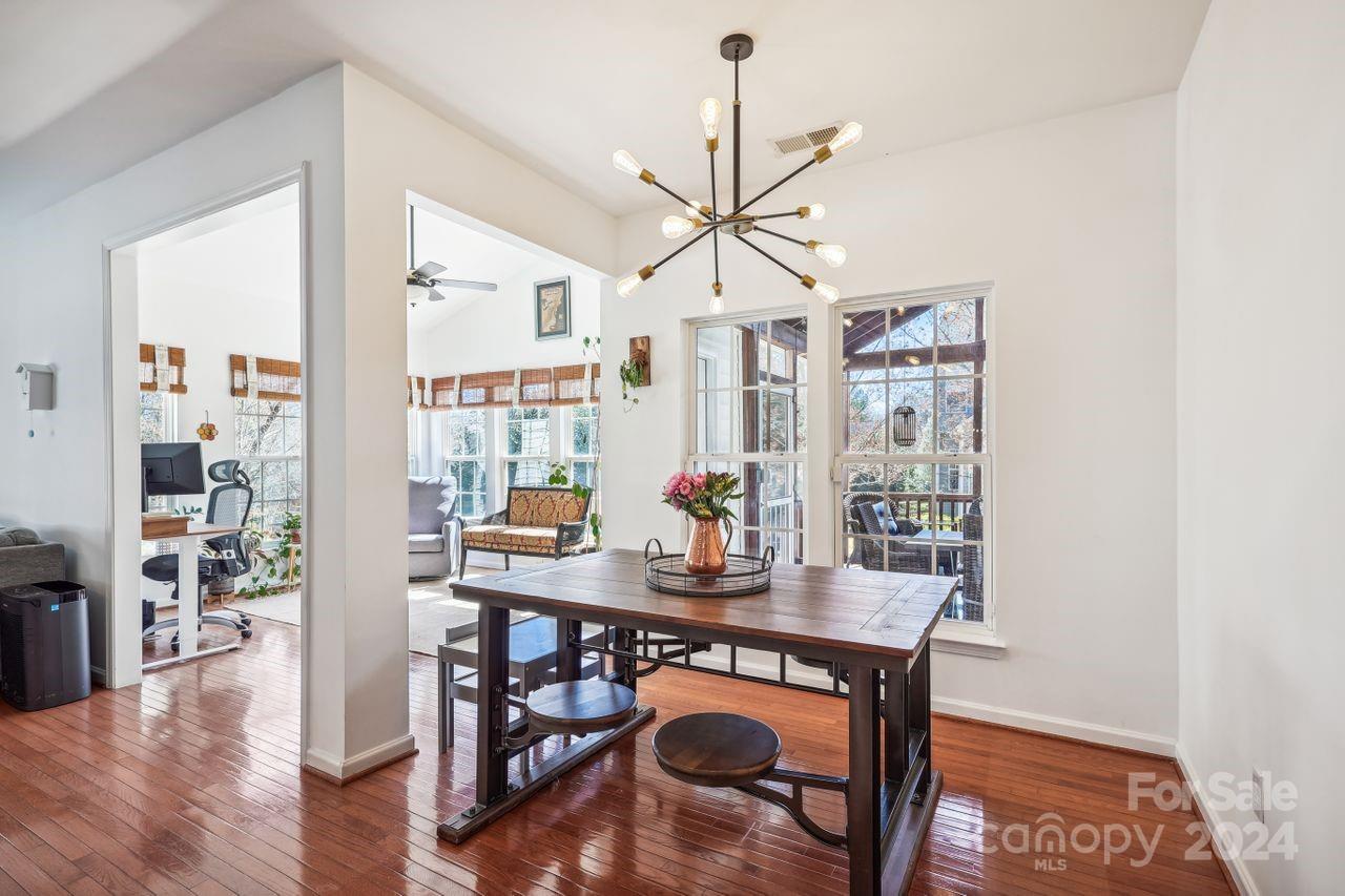 330 Drake Park Avenue Fort Mill, SC 29708 - Photo 14 of 36 a view of a dining room with furniture window and wooden floor