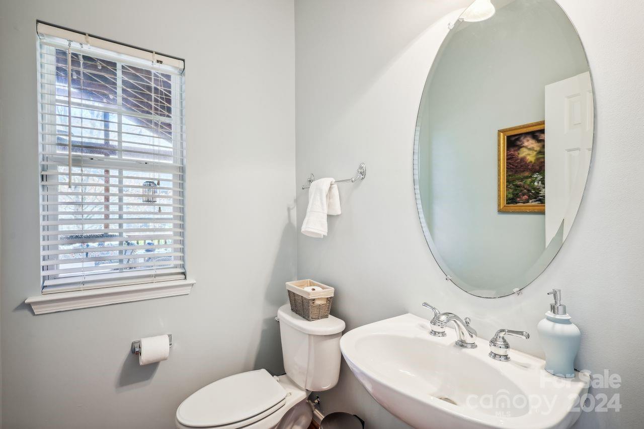 330 Drake Park Avenue Fort Mill, SC 29708 - Photo 19 of 36 a bathroom with a toilet a sink and mirror