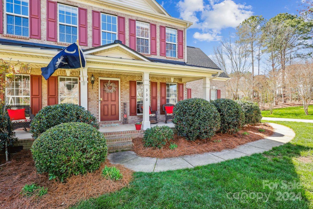 330 Drake Park Avenue Fort Mill, SC 29708 - Photo 2 of 36 a front view of a residential apartment building with a yard