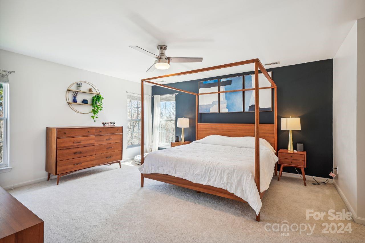 330 Drake Park Avenue Fort Mill, SC 29708 - Photo 21 of 36 a bedroom with a bed a dresser and a painting