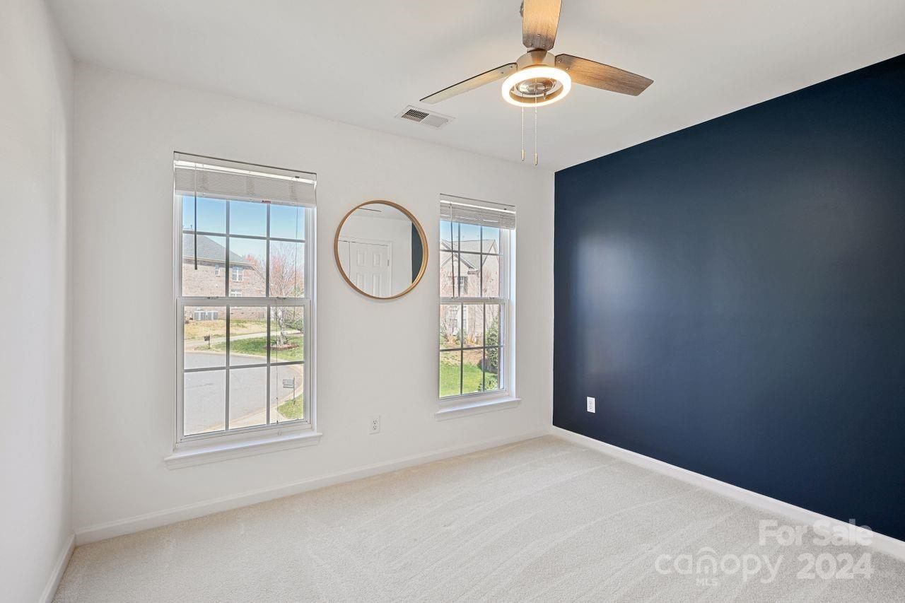 330 Drake Park Avenue Fort Mill, SC 29708 - Photo 25 of 36 an empty room with windows and fan