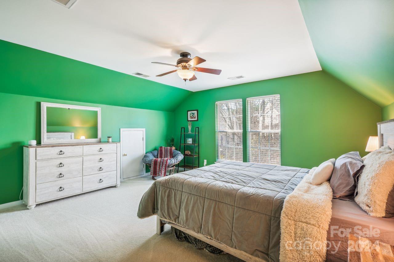 330 Drake Park Avenue Fort Mill, SC 29708 - Photo 27 of 36 a bedroom with a bed and a flat screen tv