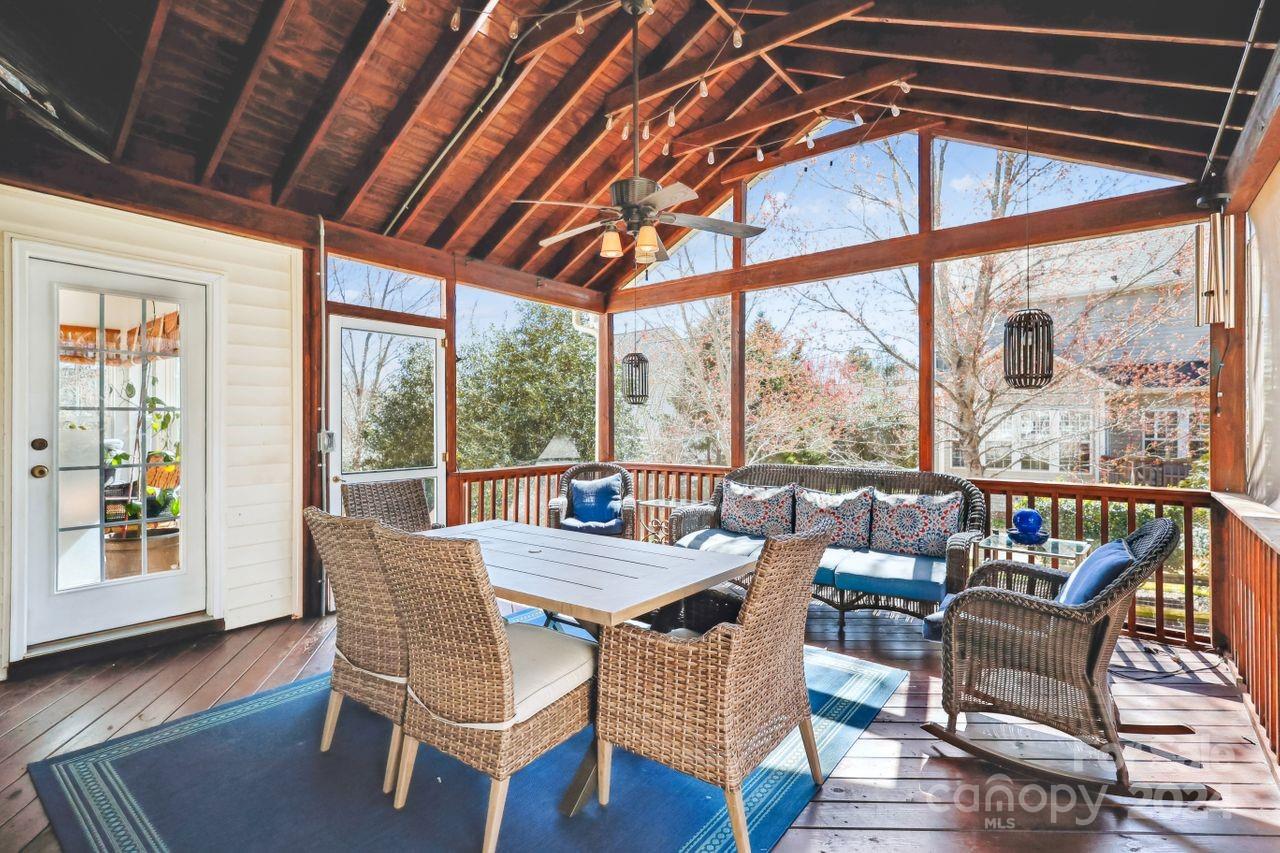 330 Drake Park Avenue Fort Mill, SC 29708 - Photo 31 of 36 a dining room with furniture wooden floor and a chandelier