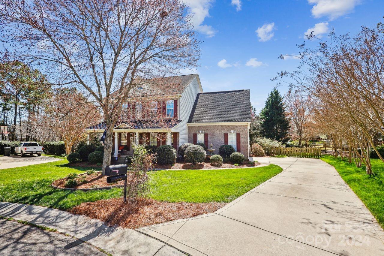 330 Drake Park Avenue Fort Mill, SC 29708 - Photo 4 of 36 a front view of a house with garden