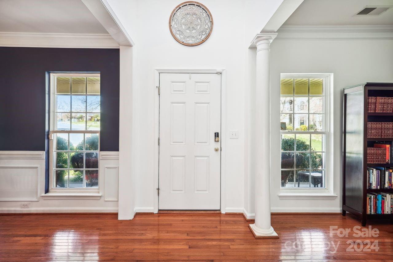 330 Drake Park Avenue Fort Mill, SC 29708 - Photo 6 of 36 a view of a room with wooden floor front door and windows