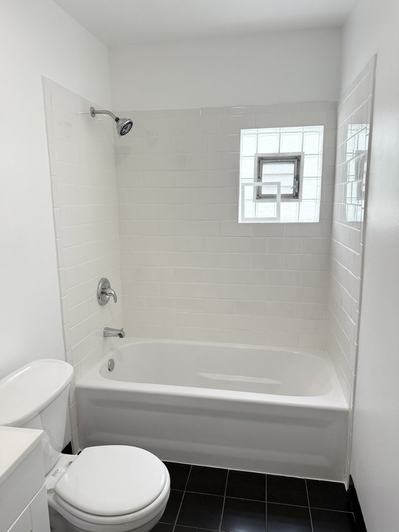 921 South Bishop Street, Unit 2 Chicago, IL 60607 - Photo 14 of 14 a bathroom with a toilet and a bathtub