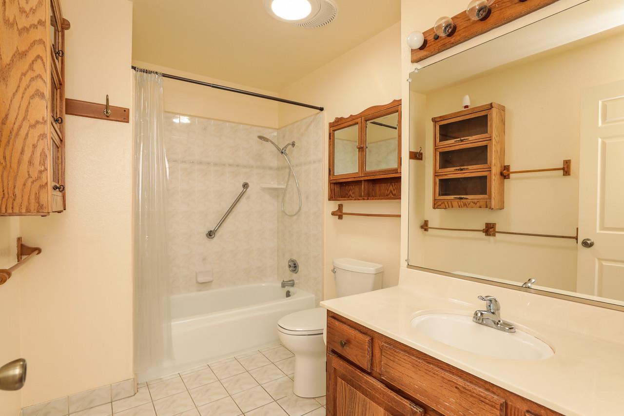 1398 Pierce Ranch Road San Jose, CA 95120 - Photo 17 of 32 a bathroom with a sink a toilet and shower