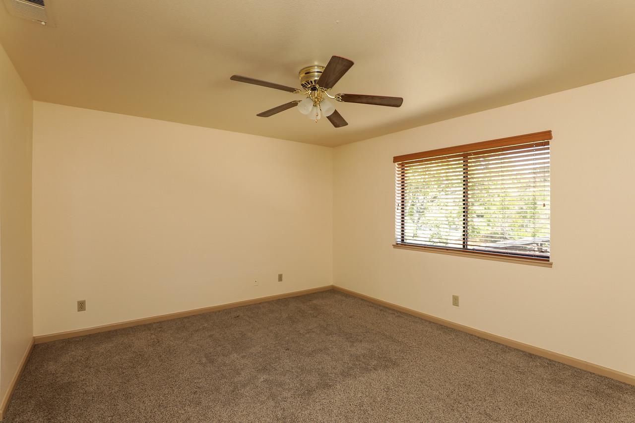 1398 Pierce Ranch Road San Jose, CA 95120 - Photo 18 of 32 an empty room with a window and a fan