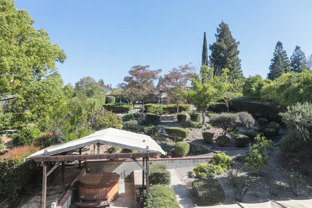 1398 Pierce Ranch Road San Jose, CA 95120 - Photo 19 of 32 a front view of a house with a yard