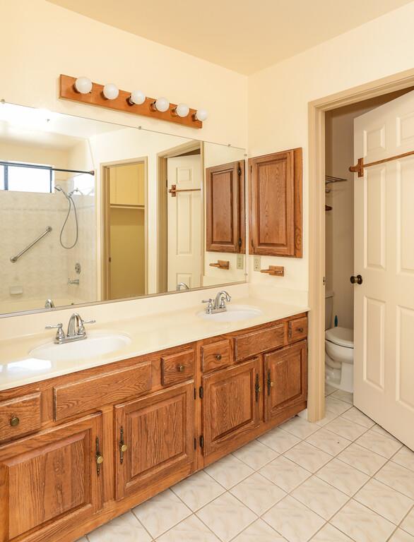 1398 Pierce Ranch Road San Jose, CA 95120 - Photo 21 of 32 a spacious bathroom with a granite countertop sink and a mirror