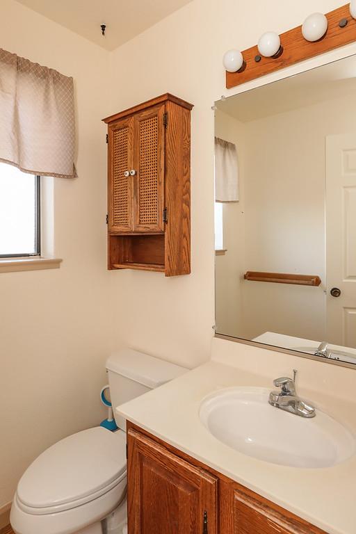 1398 Pierce Ranch Road San Jose, CA 95120 - Photo 10 of 32 a bathroom with a sink toilet and mirror