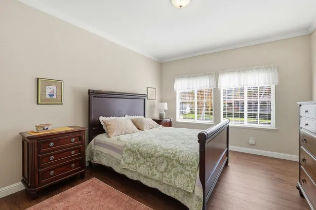 a bathroom with a sink a toilet and a large mirror