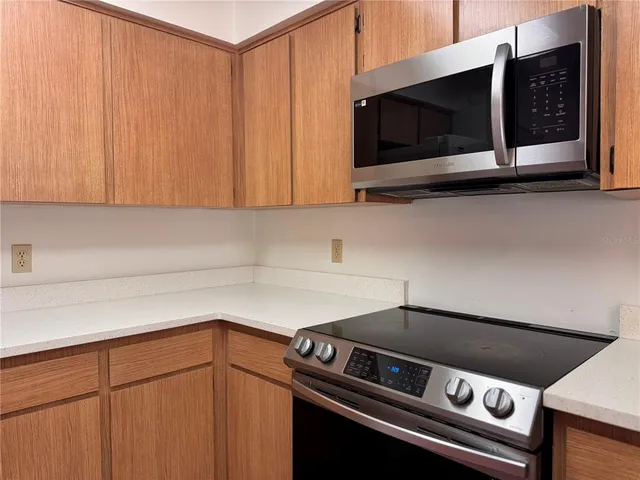 a bathroom with a sink double vanity granite tub shower and a mirror