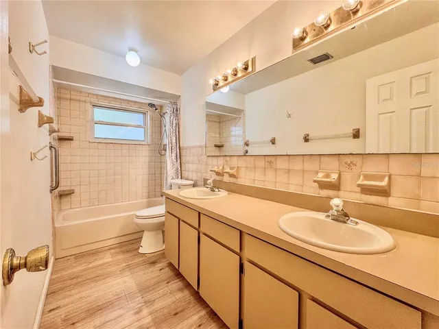 a white bath tub sitting next to a white toilet