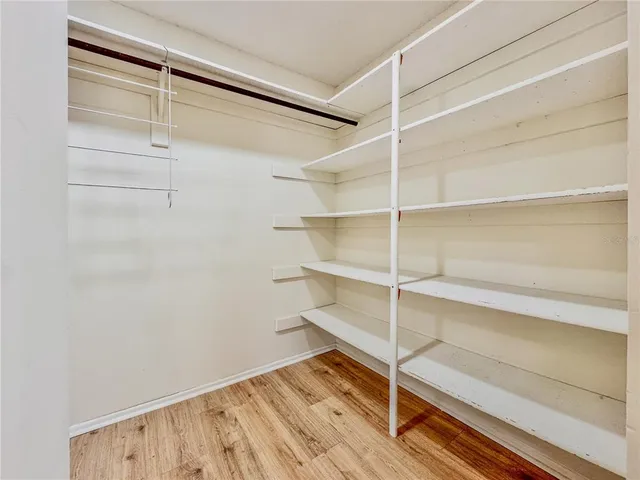 a spacious bathroom with a sink and a mirror