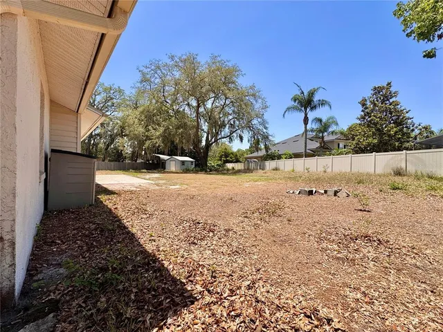 a view of a house with pool and sitting area