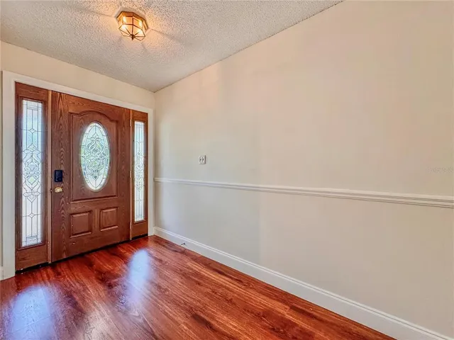 a view of a livingroom with wooden floor