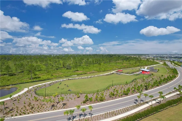 an aerial view of a houses with a lake view