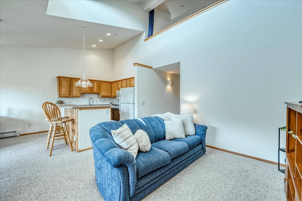 91399 Ryan Gulch Road, Unit B6 Silverthorne, CO 80498 - Photo 4 of 36 a living room with furniture and a couch