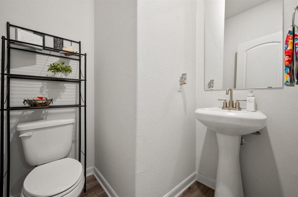 159 Sammy Fowler Avenue Venus, TX 76084 - Photo 13 of 36 a bathroom with a toilet sink and mirror