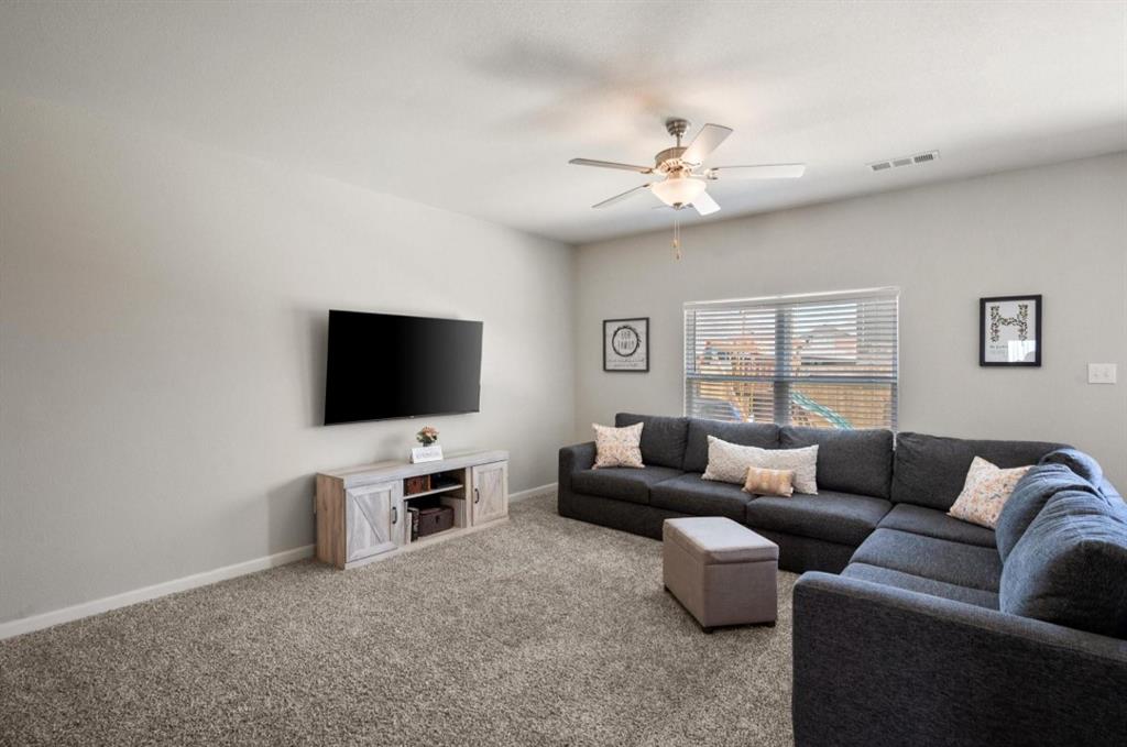 159 Sammy Fowler Avenue Venus, TX 76084 - Photo 14 of 36 a living room with furniture and a flat screen tv