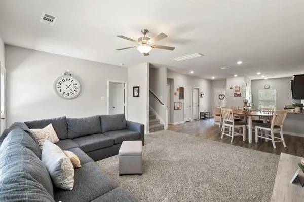 a living room with furniture and a table