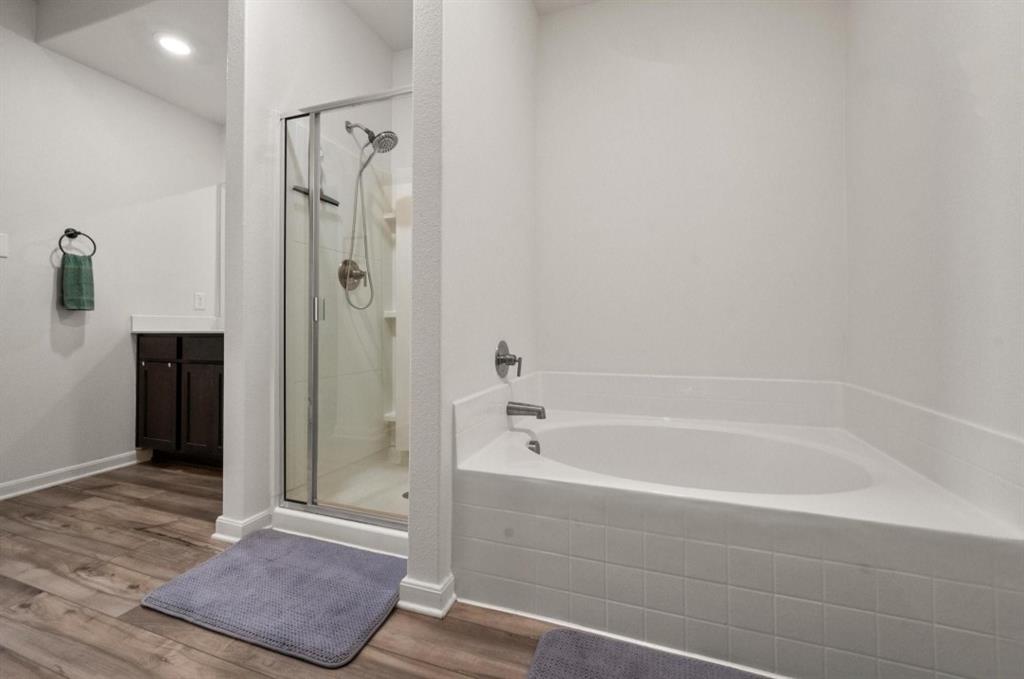 159 Sammy Fowler Avenue Venus, TX 76084 - Photo 19 of 36 a bathroom with a bathtub and a shower