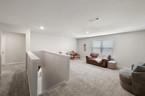 a living room with furniture and a couch