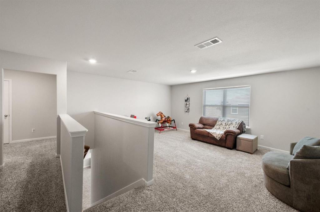 159 Sammy Fowler Avenue Venus, TX 76084 - Photo 20 of 36 a living room with furniture and a couch