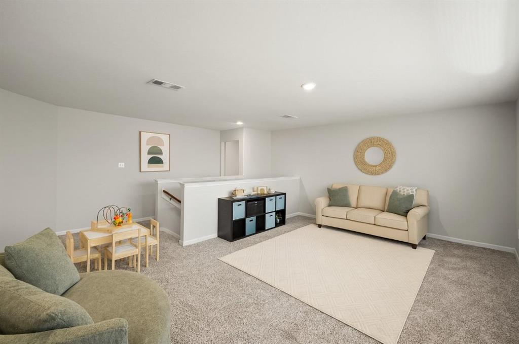 159 Sammy Fowler Avenue Venus, TX 76084 - Photo 21 of 36 a living room with furniture and a fireplace