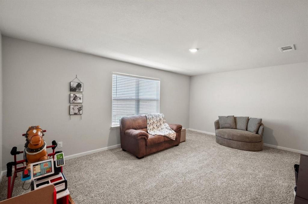 159 Sammy Fowler Avenue Venus, TX 76084 - Photo 22 of 36 a living room with furniture and a window