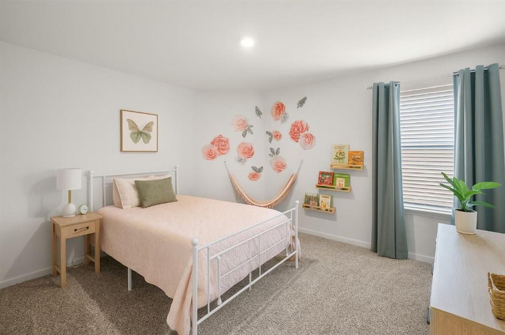 159 Sammy Fowler Avenue Venus, TX 76084 - Photo 24 of 36 a bedroom with a bed and a couch