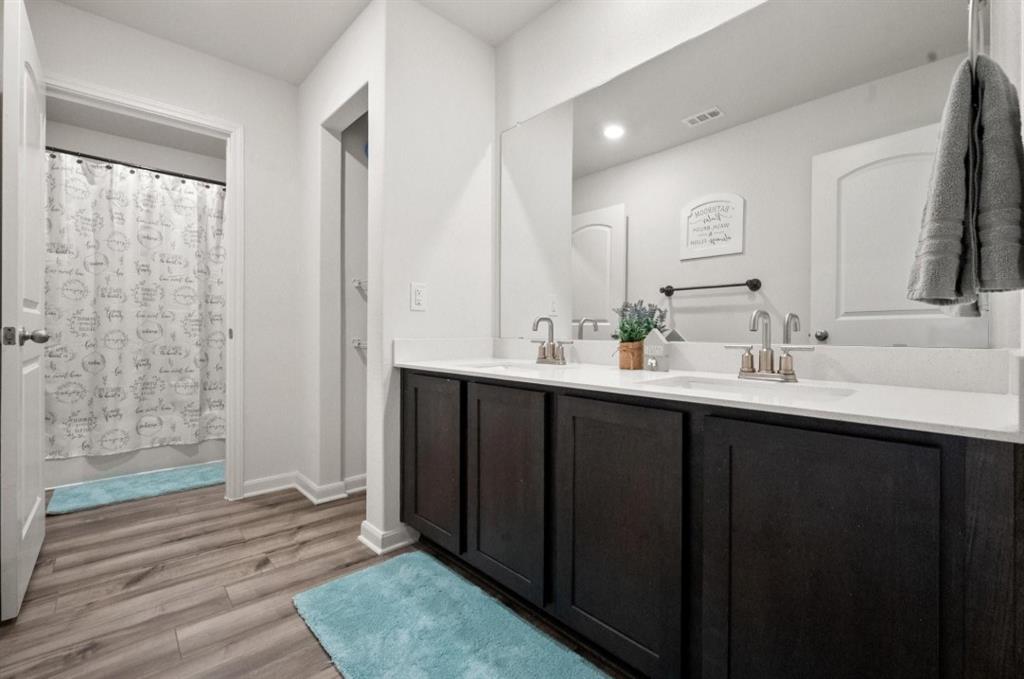 159 Sammy Fowler Avenue Venus, TX 76084 - Photo 25 of 36 a bathroom with a sink and a mirror