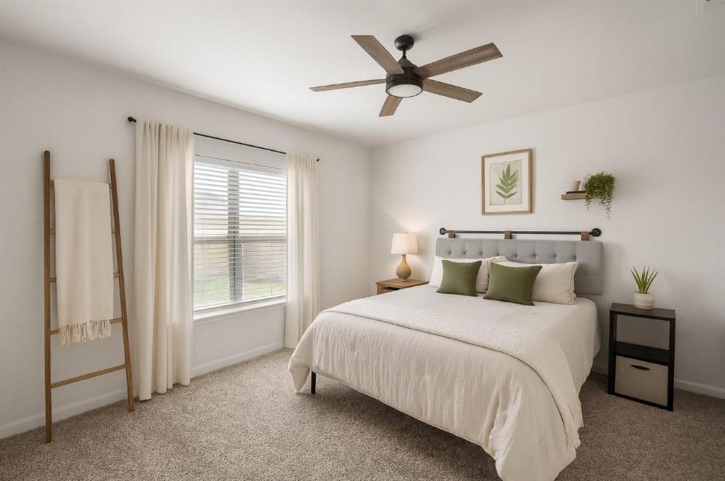 159 Sammy Fowler Avenue Venus, TX 76084 - Photo 3 of 36 a bedroom with a large bed and a window