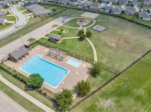 an aerial view of a house with a swimming pool