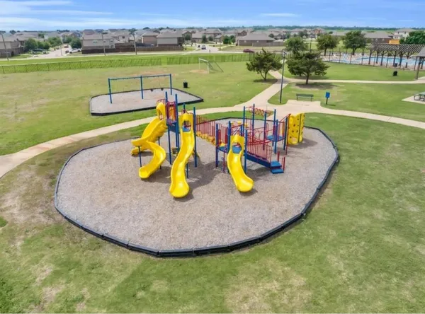 an aerial view of a house with outdoor space and ocean view