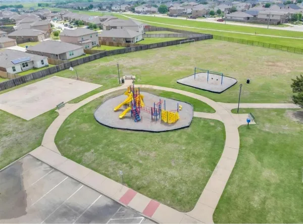 a view of a swimming pool with a yard