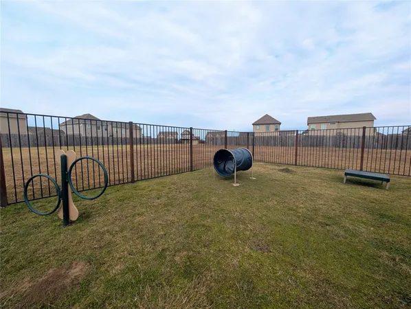 a view of a garden with a building in the background