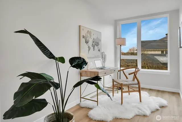 a view of a livingroom with furniture and windows