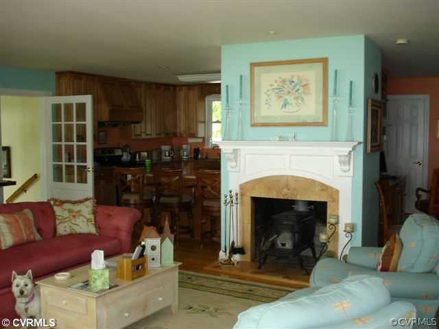 385 Ballast Point Road Hudgins, VA 23076 - Photo 4 of 12 a living room with furniture and a fireplace