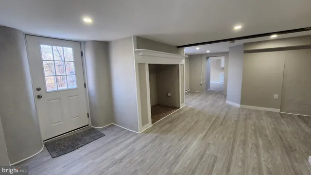 a street view with large trees