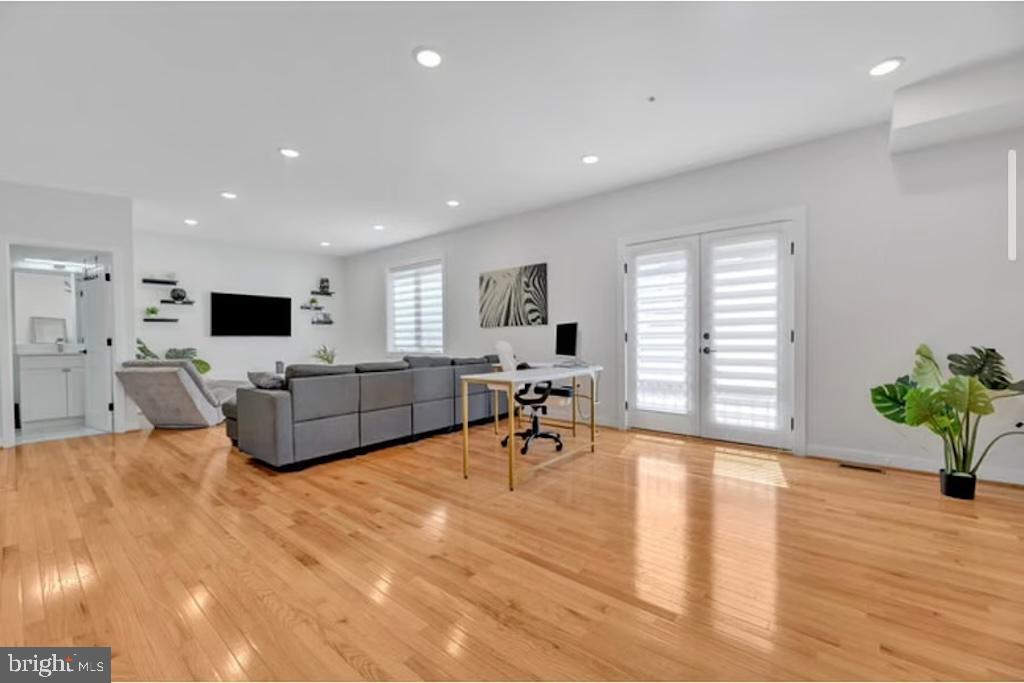 1416 22nd Street Southeast, Unit 2 Washington, DC 20020 - Photo 3 of 18 a living room with furniture and a flat screen tv