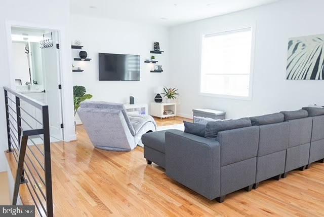 1416 22nd Street Southeast, Unit 2 Washington, DC 20020 - Photo 5 of 18 a living room with furniture and a flat screen tv